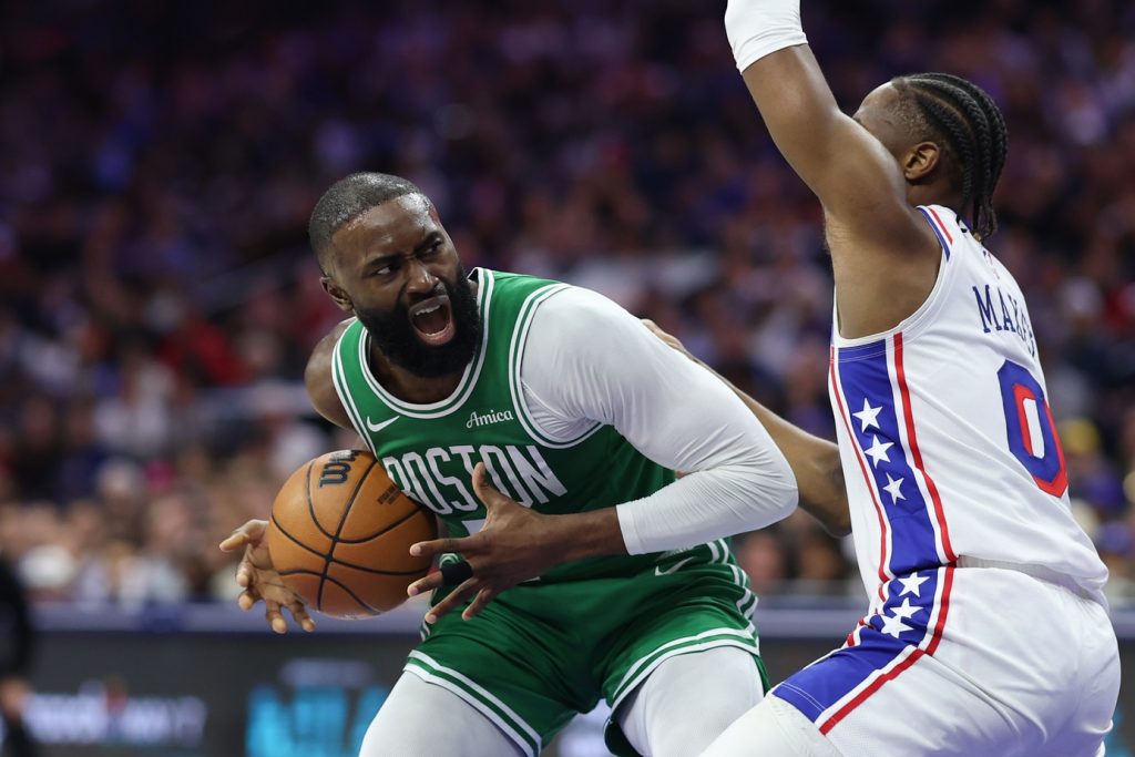Apr 30, 2026; Philadelphia, Pennsylvania, USA; Boston Celtics guard Jaylen Brown (7) drives against Philadelphia 76ers guard Tyrese Maxey (0) during the second quarter at Xfinity Mobile Arena.