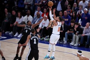 Jun 8, 2026; New York, New York, USA; New York Knicks guard Jalen Brunson (11) shoots against San Antonio Spurs guard De'aaron Fox (4) in the fourth quarter during game three of the 2026 NBA Finals at Madison Square Garden.