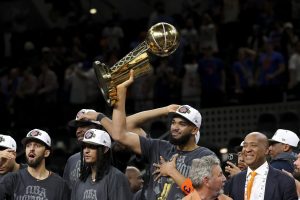 Jun 13, 2026; San Antonio, Texas, USA; New York Knicks center Karl-Anthony Towns (32) celebrates with his teammates after the Knicks defeat the San Antonio Spurs during game five of the 2026 NBA Finals at Frost Bank Center.