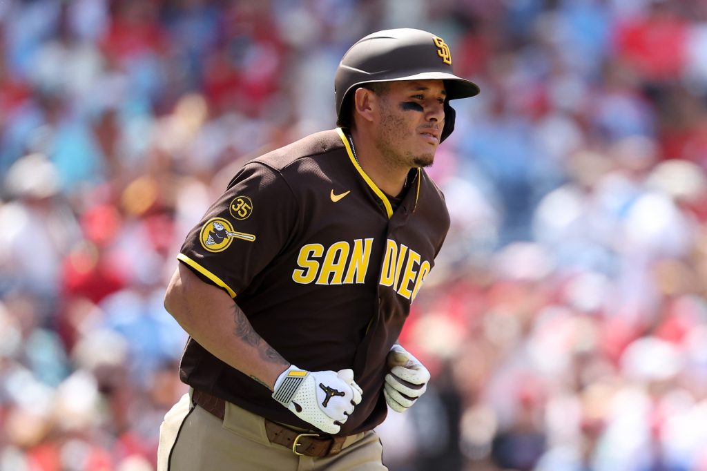Jun 4, 2026; Philadelphia, Pennsylvania, USA; San Diego Padres third baseman Manny MacHado (13) hits a two RBI home run against the Philadelphia Phillies during the seventh inning at Citizens Bank Park.