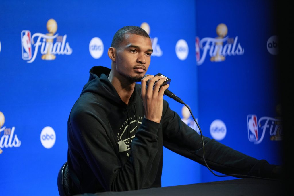 Jun 2, 2026; San Antonio, TX, USA; San Antonio Spurs forward Victor Wembanyama (1) listens to a question during media day for the 2026 NBA Finals at Frost Bank Center.
