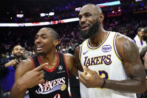 Dec 7, 2025; Philadelphia, Pennsylvania, USA; Los Angeles Lakers forward Lebron James (23) and Philadelphia 76ers guard Tyrese Maxey react with each other after the game at Xfinity Mobile Arena.