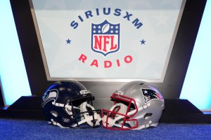 Feb 3, 2026; San Francisco, CA, USA; Seattle Seahawks and New England Patriots helmets on the SiriusXM NFL radio set at the Super Bowl LX media center at the Moscone Center.
