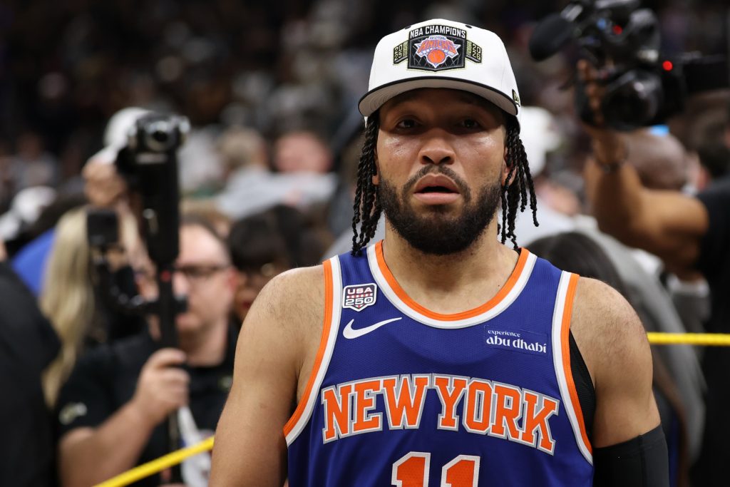 Jun 13, 2026; San Antonio, Texas, USA; New York Knicks guard Jalen Brunson (11) walks to the end of the court prior to the championship trophy celebration after game five of the 2026 NBA Finals against the San Antonio Spurs at Frost Bank Center.