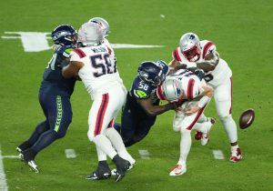 Feb 8, 2026; Santa Clara, CA, USA; New England Patriots quarterback Drake Maye (10) fumbles as he is sacked by Seattle Seahawks linebacker Derick Hall (58) in the second half in Super Bowl LX at Levi's Stadium.