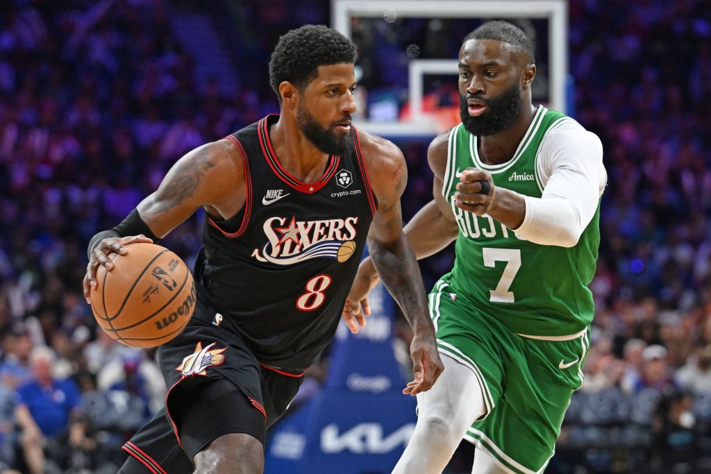 Apr 24, 2026; Philadelphia, Pennsylvania, USA; Philadelphia 76ers forward Paul George (8) drives to the basket against Boston Celtics guard Jaylen Brown (7) during the second half at Xfinity Mobile Arena.