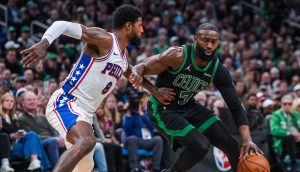 Apr 28, 2026; Boston, Massachusetts, USA; Boston Celtics guard Jaylen Brown (7) drives the ball against Philadelphia 76ers forward Paul George (8) in the second half during game five of the first round of the 2026 NBA Playoffs at TD Garden.