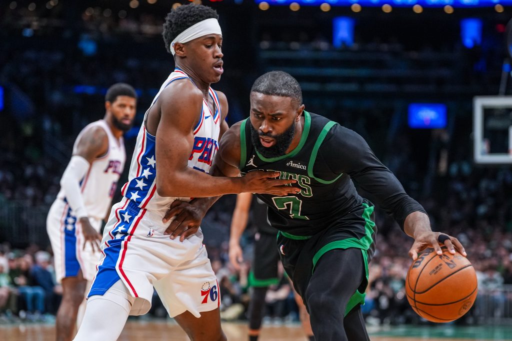 Apr 28, 2026; Boston, Massachusetts, USA; Boston Celtics guard Jaylen Brown (7) drives the ball against Philadelphia 76ers guard Vj Edgecombe (77) in the second half during game five of the first round of the 2026 NBA Playoffs at TD Garden.