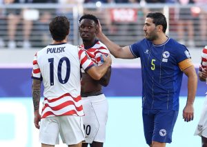 July 1, 2026; Santa Clara, California, U.S.; Bosnia and Herzegovina's Sead Kolasinac consoles Folarin Balogun of the U.S. after he was shown a red card following a VAR review.