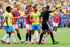 July 5, 2026; East Rutherford, New Jersey, U.S.; Brazil's Matheus Cunha remonstrates with referee Ismail Elfath after Norway's Kristoffer Ajer fouls him to concede a penalty after VAR review.