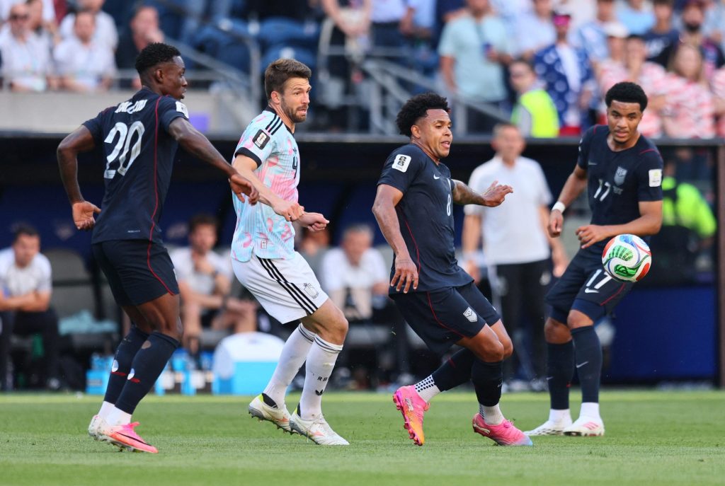July 6, 2026; Seattle, Washington, U.S.; Weston McKennie and Folarin Balogun of the U.S. in action with Belgium's Brandon Mechele.