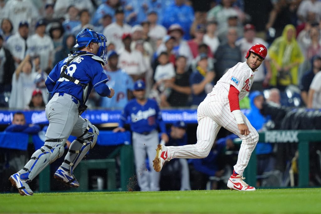 Jul 21, 2026; Philadelphia, Pennsylvania, USA; Philadelphia Phillies outfielder Justin Crawford (2) is caught in a rundown against Los Angeles Dodgers catcher Dalton Rushing (68) in the ninth inning at Citizens Bank Park.