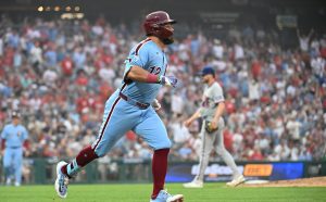 Jul 16, 2026; Philadelphia, Pennsylvania, USA; Philadelphia Phillies designated hitter Kyle Schwarber (12) watches his double during the sixth inning against the New York Mets at Citizens Bank Park.