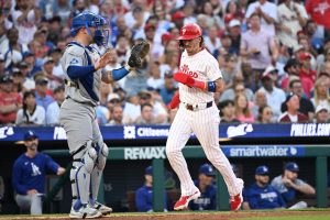 Jul 20, 2026; Philadelphia, Pennsylvania, USA; Philadelphia Phillies second baseman Bryson Stott (5) scores a run against Los Angeles Dodgers catcher Dalton Rushing (68) during the second inning at Citizens Bank Park.