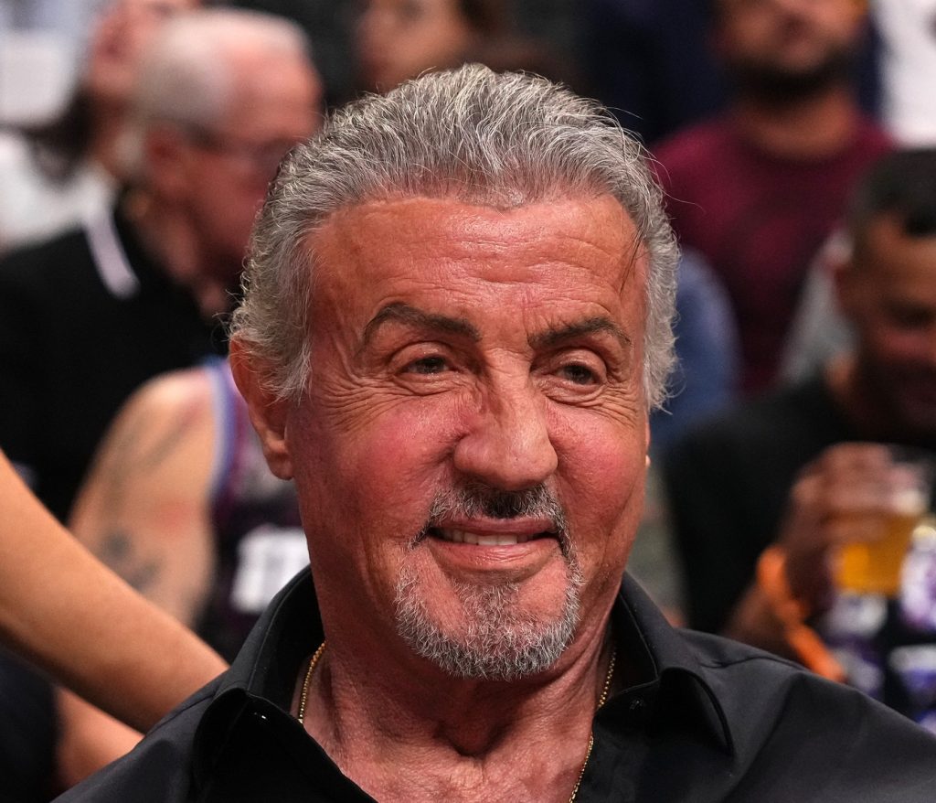 Oct 25, 2023; Miami, Florida, USA; American actor and filmmaker Sylvester Stallone sits court side of the game between the Miami Heat and the Detroit Pistons during the first half at Kaseya Center.