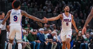Apr 28, 2026; Boston, Massachusetts, USA; Philadelphia 76ers guard Quentin Grimes (5) and guard Kelly Oubre Jr. (9) react after a play against the Boston Celtics in the second half during game five of the first round of the 2026 NBA Playoffs at TD Garden.
