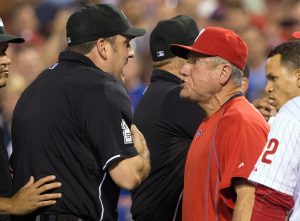 Aug 25, 2015; Philadelphia, PA, USA; Philadelphia Phillies bench coach Larry Bowa (10) is ejected by umpire Dan Bellino (2) after arguing a quick pitch by New York Mets relief pitcher Hansel Robles (not pictured) during the seventh inning at Citizens Bank Park. The Mets won 6-5.