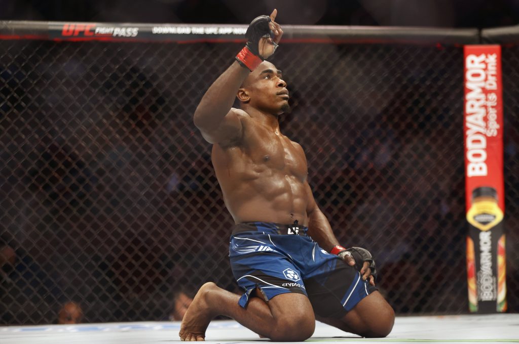 Feb 12, 2022; Houston, Texas, UNITED STATES; Jeremiah Wells (red gloves) reacts to the fight against Blood Diamond (blue gloves) during UFC 271 at Toyota Center.