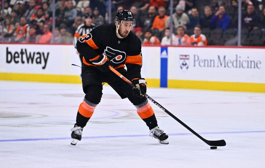 Mar 23, 2023; Philadelphia, Pennsylvania, USA; Philadelphia Flyers center Kevin Hayes (13) controls the puck against the Minnesota Wild in the third period at Wells Fargo Center.