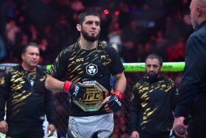 Jan 18, 2025; Inglewood, California, USA; Islam Makhachev (red gloves) reacts after defeating Renato Moicano (not pictured) in a lightweight title fight during UFC 311 at Intuit Dome.