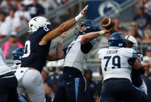 Sep 13, 2025; University Park, Pennsylvania, USA; Villanova Wildcats quarterback Pat McQuaide (7) throws the ball while being pressured by Penn State Nittany Lions linebacker Dominic DeLuca (0) during the third quarter at Beaver Stadium.