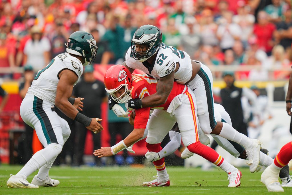 Sep 14, 2025; Kansas City, Missouri, USA; Philadelphia Eagles defensive end Za'Darius Smith (52) sacks Kansas City Chiefs quarterback Patrick Mahomes (15) during the second quarter of the game at GEHA Field at Arrowhead Stadium.