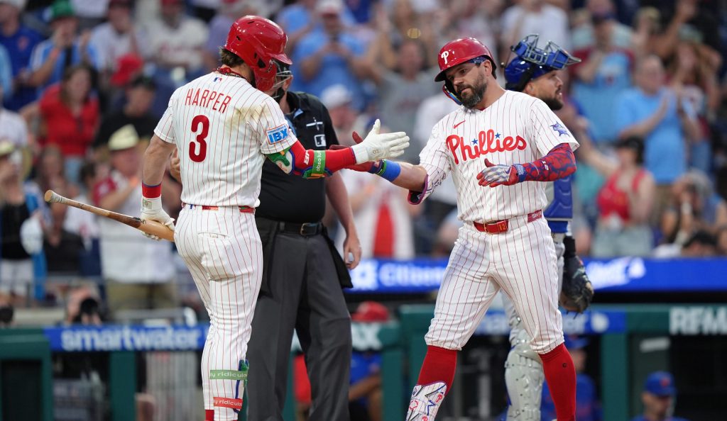 Jun 20, 2026; Philadelphia, Pennsylvania, USA; Philadelphia Phillies designated hitter Kyle Schwarber (12) reacts with infielder Bryce Harper (3) after hitting a home run against the New York Mets in the third inning at Citizens Bank Park.