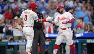 Jun 20, 2026; Philadelphia, Pennsylvania, USA; Philadelphia Phillies designated hitter Kyle Schwarber (12) reacts with infielder Bryce Harper (3) after hitting a home run against the New York Mets in the third inning at Citizens Bank Park.