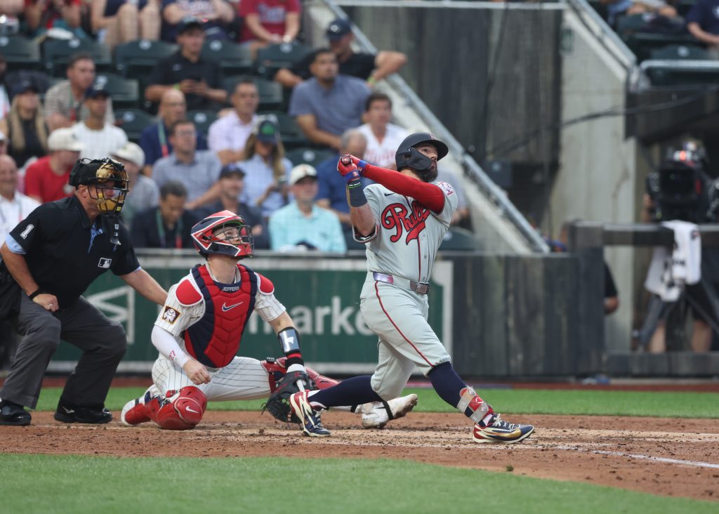 Aug 13, 2026; Dyersville, Iowa, USA; Minnesota Twins catcher Ryan Jeffers (27) watches a home run from Philadelphia Phillies designated hitter Kyle Schwarber (12) at the Field of Dreams.