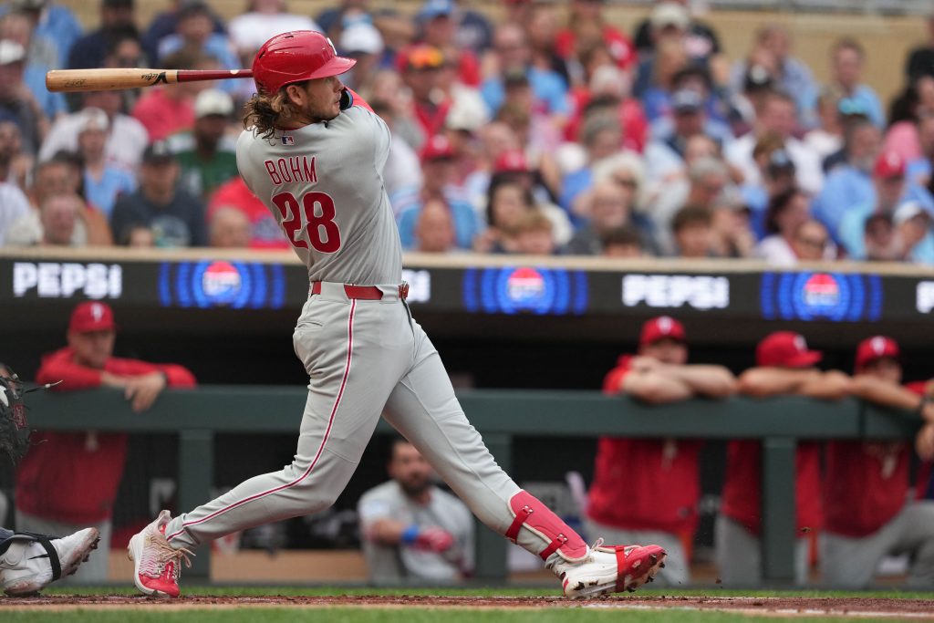 Aug 15, 2026; Minneapolis, Minnesota, USA; Philadelphia Phillies first baseman Alec Bohm (28) hits a double during the second inning against the Minnesota Twins at Target Field.