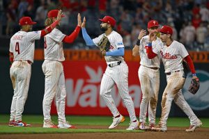 Aug 17, 2026; Philadelphia, Pennsylvania, USA; Philadelphia Phillies center fielder Derek Hill (49) high fives teammates after win against the Miami Marlins at Citizens Bank Park.