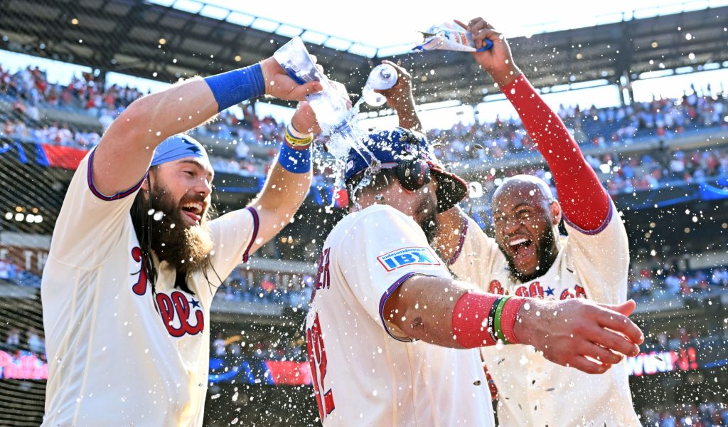 Aug 23, 2026; Philadelphia, Pennsylvania, USA; Philadelphia Phillies designated hitter Kyle Schwarber (12) celebrates his walk-off home run in the ninth inning with left fielder Brandon Marsh (16) and right fielder Bryan de la Cruz (41) against the St. Louis Cardinals at Citizens Bank Park.
