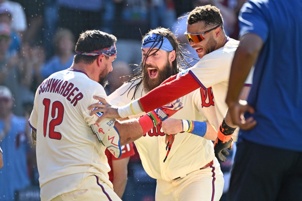 Aug 23, 2026; Philadelphia, Pennsylvania, USA; Philadelphia Phillies designated hitter Kyle Schwarber (12) celebrates his walk-off two-run home run with left fielder Brandon Marsh (16) and center fielder Justin Crawford (2) against the St. Louis Cardinals during the ninth inning at Citizens Bank Park.