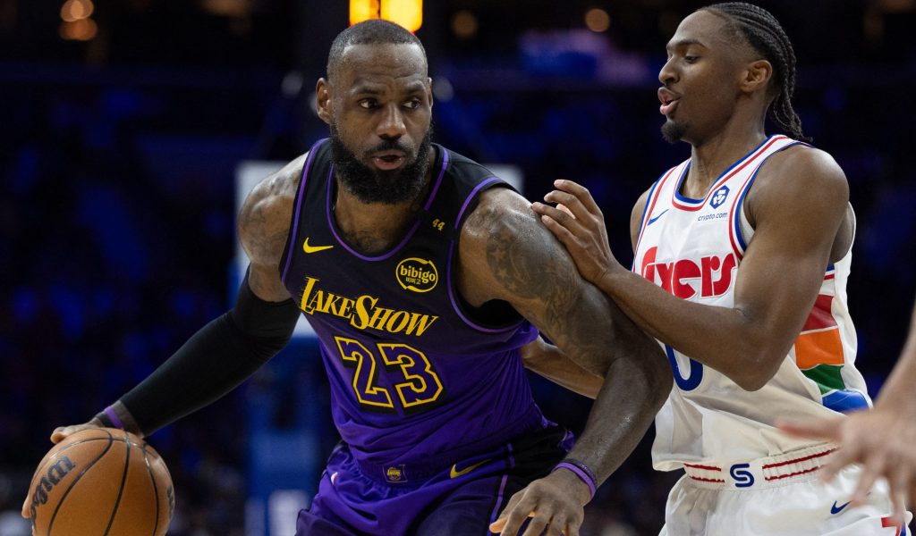Jan 28, 2025; Philadelphia, Pennsylvania, USA; Los Angeles Lakers forward LeBron James (23) controls the ball against Philadelphia 76ers guard Tyrese Maxey (0) during the second quarter at Wells Fargo Center.