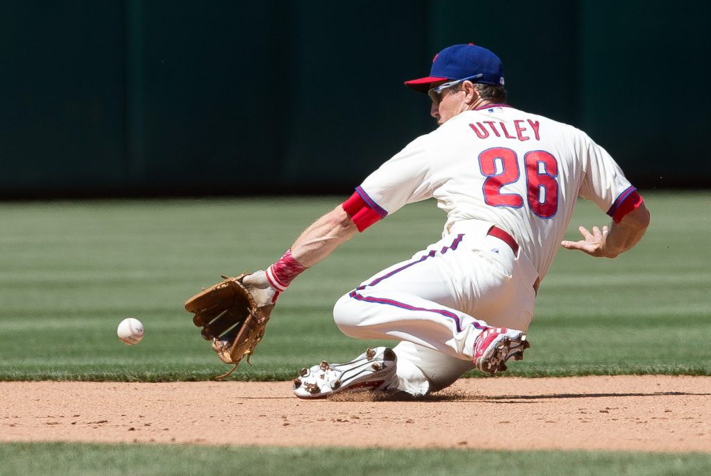May 14, 2015; Philadelphia, PA, USA; Philadelphia Phillies second baseman Chase Utley (26) fields a ground ball for an out against the Pittsburgh Pirates at Citizens Bank Park.