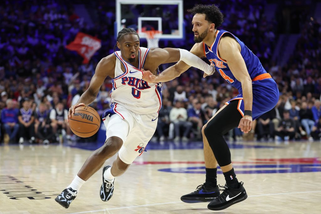 May 8, 2026; Philadelphia, Pennsylvania, USA; Philadelphia 76ers guard Tyrese Maxey (0) drives against New York Knicks guard Landry Shamet (44) during the fourth quarter of game three of the second round of the 2026 NBA Playoffs at Xfinity Mobile Arena.