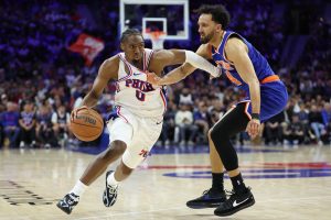 May 8, 2026; Philadelphia, Pennsylvania, USA; Philadelphia 76ers guard Tyrese Maxey (0) drives against New York Knicks guard Landry Shamet (44) during the fourth quarter of game three of the second round of the 2026 NBA Playoffs at Xfinity Mobile Arena.