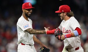 Aug 3, 2025; Philadelphia, Pennsylvania, USA; Philadelphia Phillies pitcher Cristopher Sanchez (L) slaps hands with second base Bryson Stott (R) after his play to end the eighth inning against the Detroit Tigers at Citizens Bank Park.