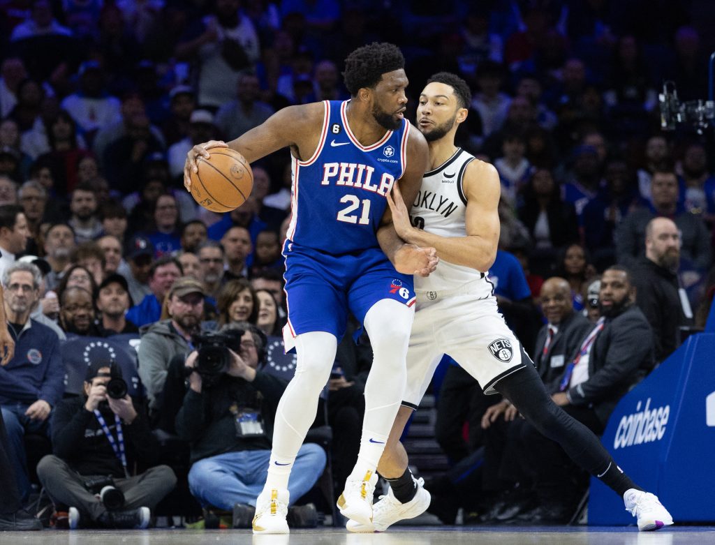 Jan 25, 2023; Philadelphia, Pennsylvania, USA; Philadelphia 76ers center Joel Embiid (21) controls the ball against Brooklyn Nets guard Ben Simmons (10) during the first quarter at Wells Fargo Center.