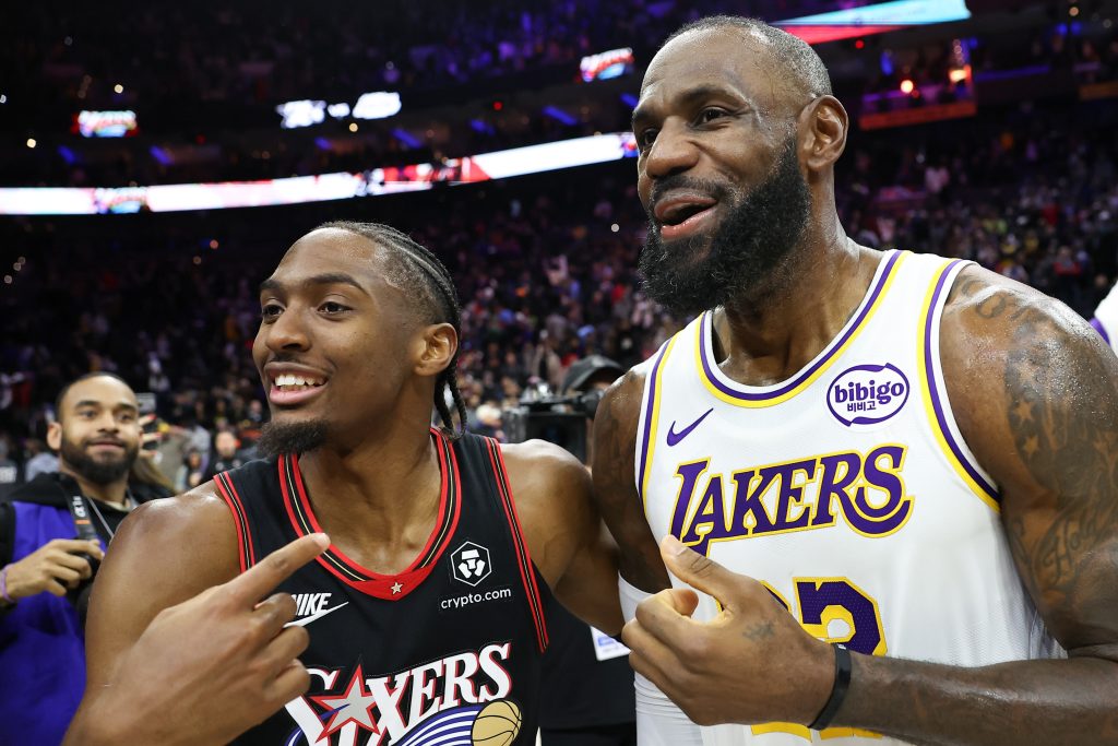 Dec 7, 2025; Philadelphia, Pennsylvania, USA; Los Angeles Lakers forward Lebron James (23) and Philadelphia 76ers guard Tyrese Maxey after the game at Xfinity Mobile Arena.