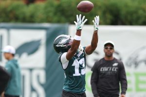 Jul 30, 2026; Philadelphia, PA, USA; Philadelphia Eagles wide receiver Dontayvion Wicks (13) reaches for a pass during training camp at Jefferson Health Training Complex.
