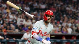 Aug 31, 2026; Phoenix, Arizona, USA; Philadelphia Phillies outfielder Bryce Harper tosses his bat after flying out to end the fifth inning against the Arizona Diamondbacks at Chase Field.