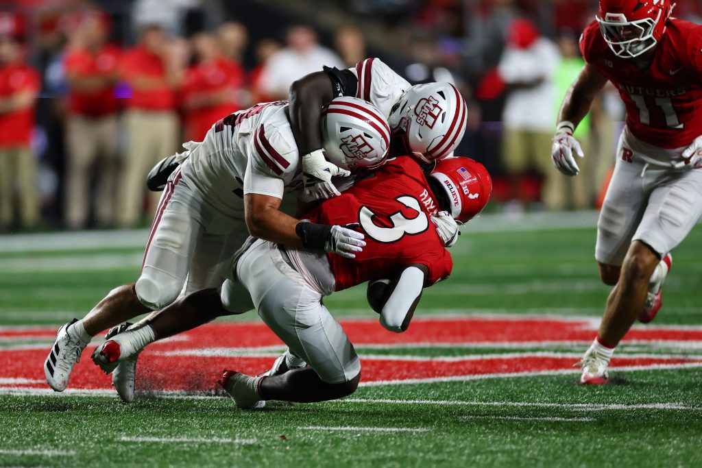 Sep 3, 2026; Piscataway, New Jersey, USA; Massachusetts Minutemen linebacker Timmy Hinspeter (44) tackles Rutgers defensive back Bo Mascoe (3) during the fourth quarter at SHI Stadium.