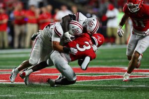 Sep 3, 2026; Piscataway, New Jersey, USA; Massachusetts Minutemen linebacker Timmy Hinspeter (44) tackles Rutgers defensive back Bo Mascoe (3) during the fourth quarter at SHI Stadium.
