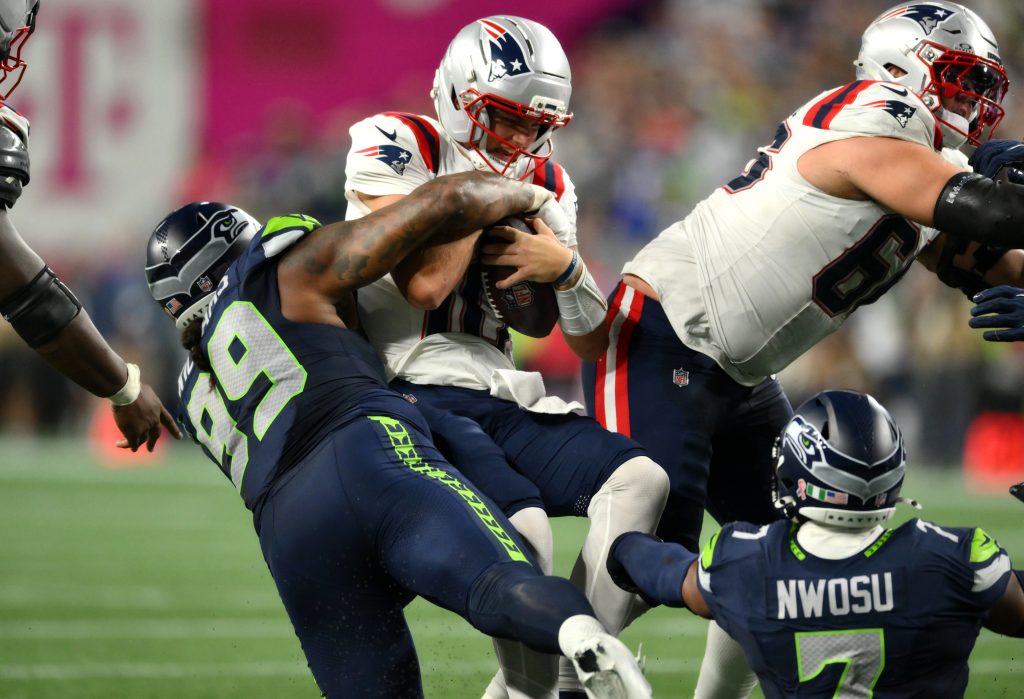 Sep 9, 2026; Seattle, Washington, USA; Seattle Seahawks defensive tackle Leonard Williams (99) sacks New England Patriots quarterback Drake Maye (10) during the fourth quarter at Lumen Field.