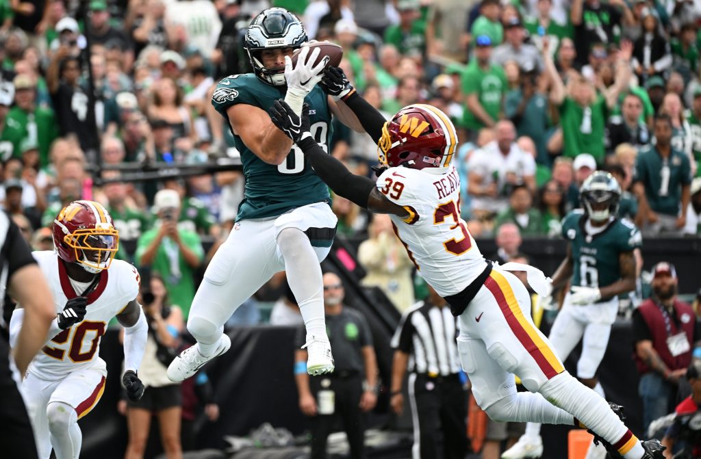Sep 13, 2026; Philadelphia, Pennsylvania, USA; Philadelphia Eagles tight end Dallas Goedert (88) catches a pass for a touchdown against Washington Commanders safety Jeremy Reaves (39) during the first half at Lincoln Financial Field. Mandatory Credit: