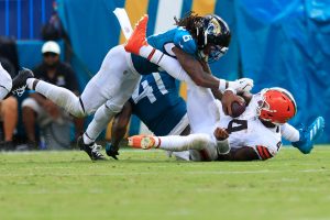 Jacksonville Jaguars safety Antonio Johnson (6) tackles Cleveland Browns quarterback Deshaun Watson (4) during the fourth quarter of an NFL football matchup at EverBank Stadium on Sunday, Sept. 13, 2026, in Jacksonville, Fla. The Jaguars defeated the Browns 34-10. [