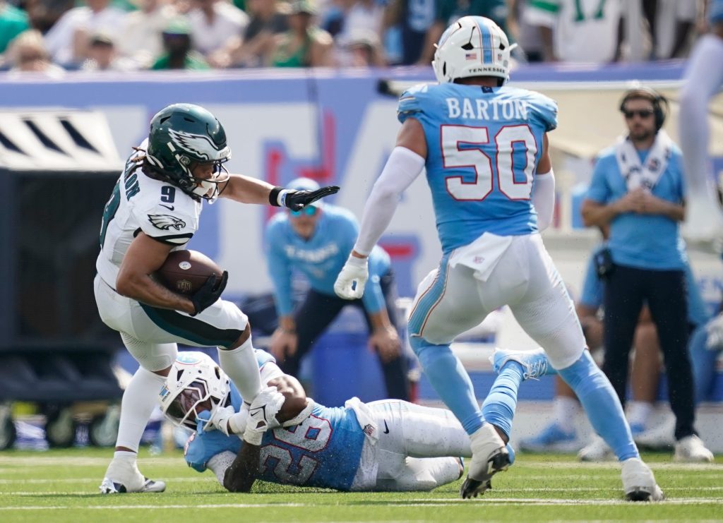 Tennessee Titans cornerback Marcus Harris (26) trips up Philadelphia Eagles wide receiver Makai Lemon (9) during the fourth quarter at Nissan Stadium in Nashville, Tenn., Sunday, Sept. 20, 2026.