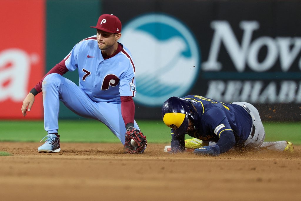 Sep 24, 2026; Philadelphia, Pennsylvania, USA; Milwaukee Brewers left fielder Jackson Chourio (11) steals second base past Philadelphia Phillies shortstop Trea Turner (7) during the eighth inning at Citizens Bank Park.