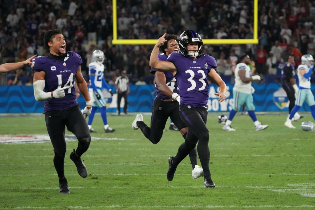 Sep 27, 2026; Rio De Janeiro, BRA; Baltimore Ravens safety Kyle Hamilton (14) and kicker Tyler Loop (33) celebrate after Loop kicks the game winning field goal against the Dallas Cowboys during the game at Maracana Stadium.